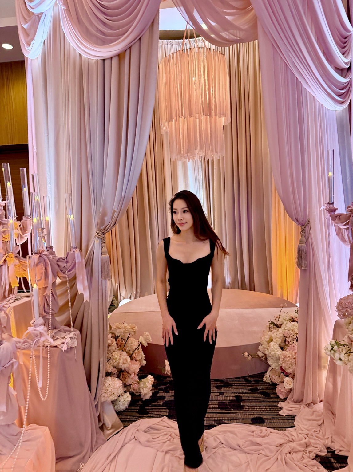 Peggy Tsai in a black dress at an elegant event