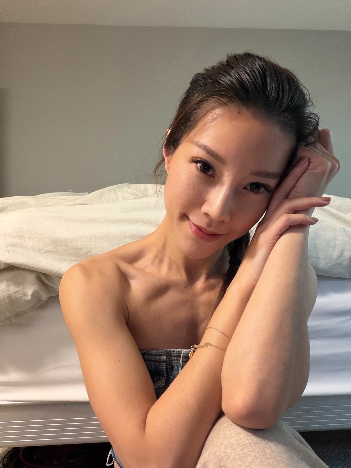 Peggy Tsai smiling in a relaxed portrait